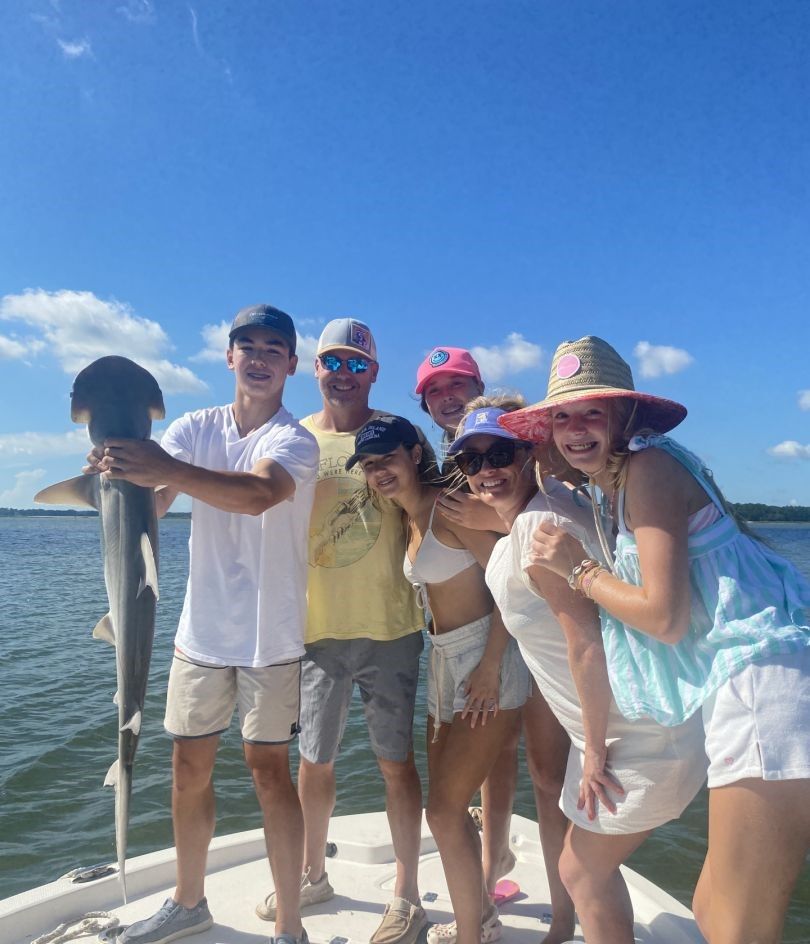 6 people fishing in unknown location