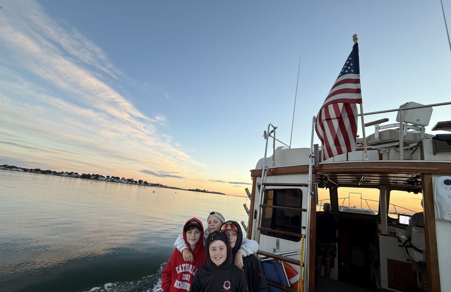 Four people fishing in an unknown location