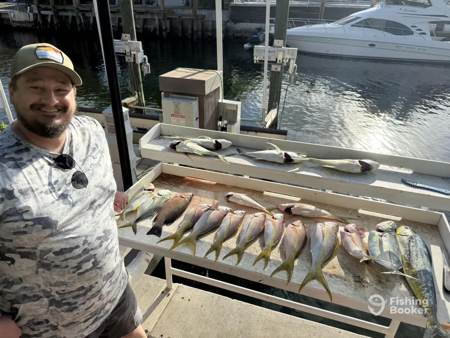 Fisherman enjoying a great day of fishing with 4 fish caught