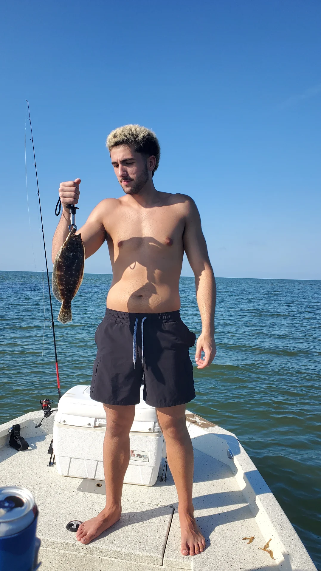 Summer flounder caught while fishing on boat in ocean waters
