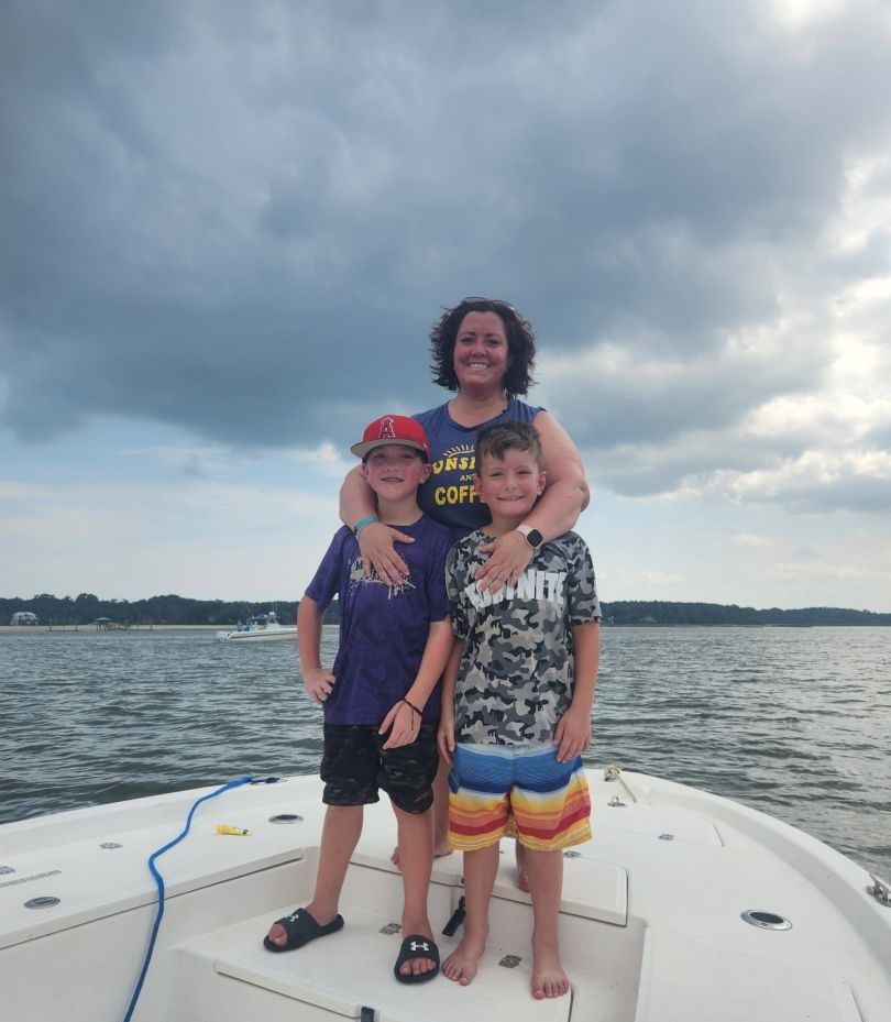 Three people fishing at a scenic location
