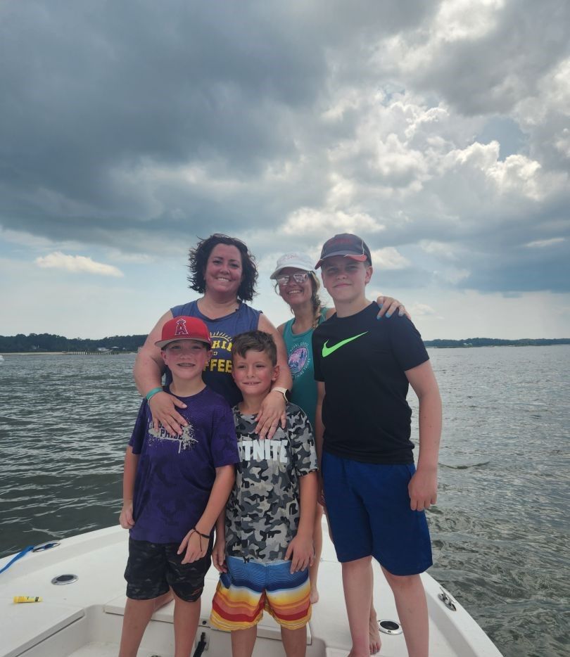 Five people fishing at an unknown location