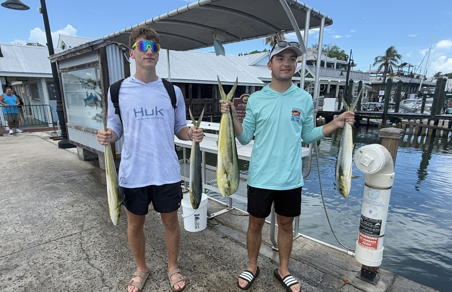 Three people enjoy a successful fishing trip