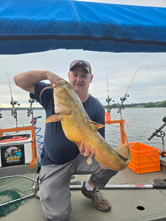 Reeling in a 19-inch Flathead Catfish on a partly cloudy day!