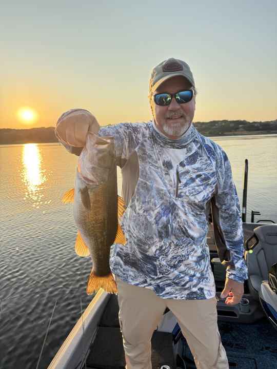 Nice Florida Bass caught on fly fishing light tackle during clear conditions at sunset.