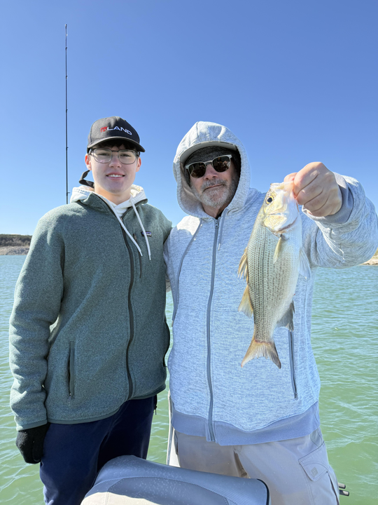 Spending a relaxing day on the lake, reeling in a few good ones.