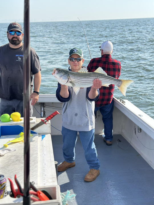 Hooked a big striped bass while deep-sea fishing in Neptune City, NJ!
