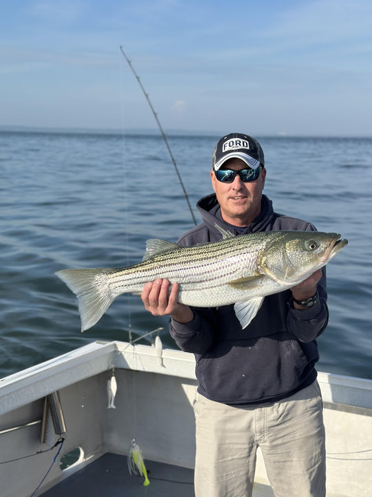 Hooked a big striped bass using a variety of techniques on this perfect fishing day!