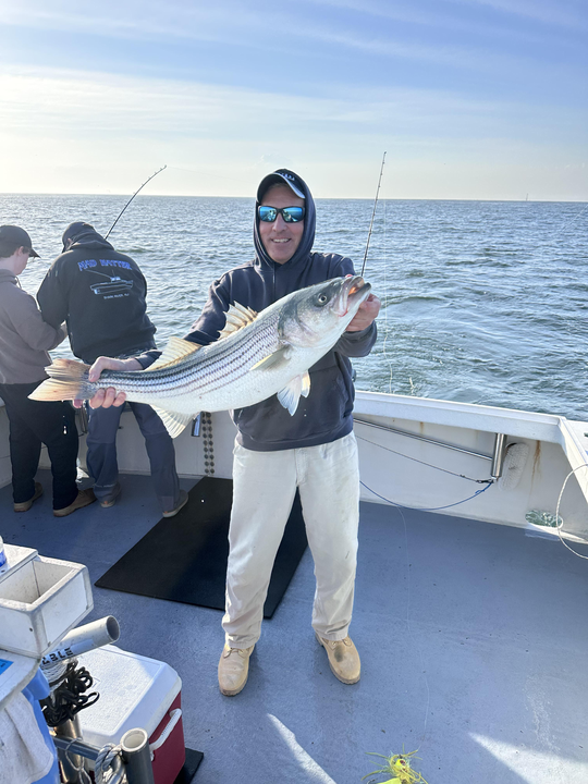Landed a big striped bass while deep sea fishing in Neptune City, NJ!