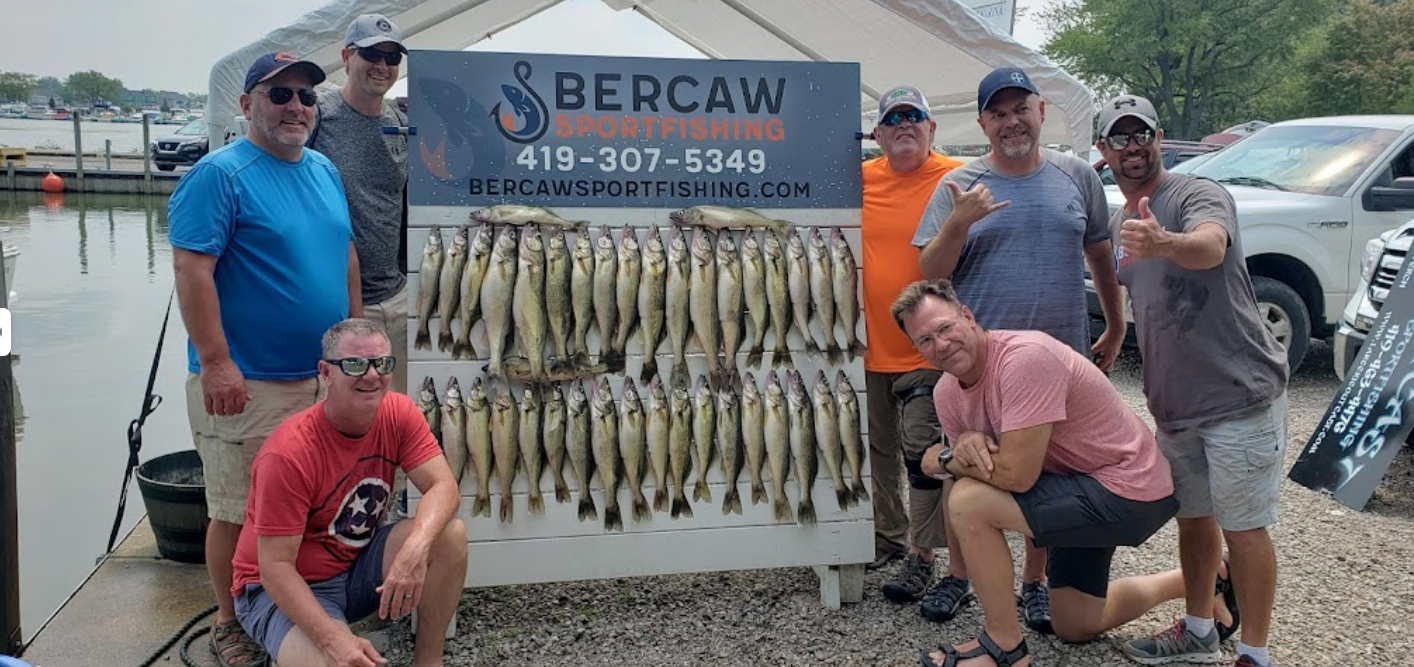 Group of 7 people fishing at an unknown location