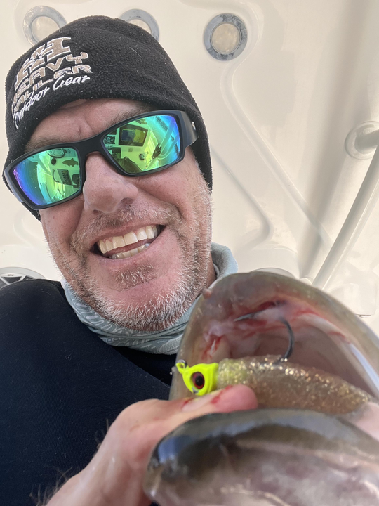 Light tackle fishing produced this exciting catch with a yellow lure - what an adventure on the water!