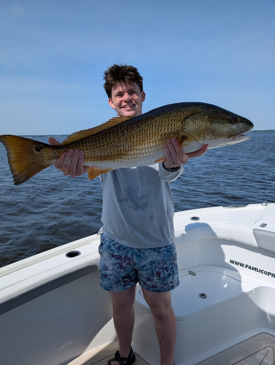 Angler reeled in a massive redfish on a perfect day!