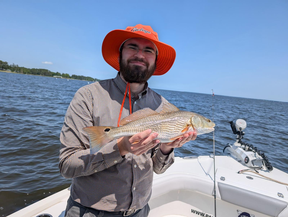 A prized Redfish snatched from the waters using Lightweight Tackle on a partly cloudy day!