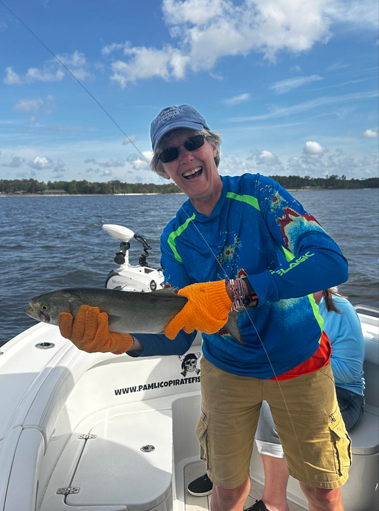 Spending a peaceful day on the water, reeling in a catch or two.