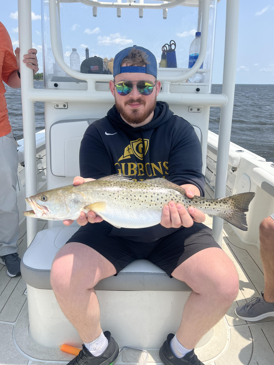 Spotted weakfish landed at Minnesott Beach with a light tackle technique on a partly cloudy day.