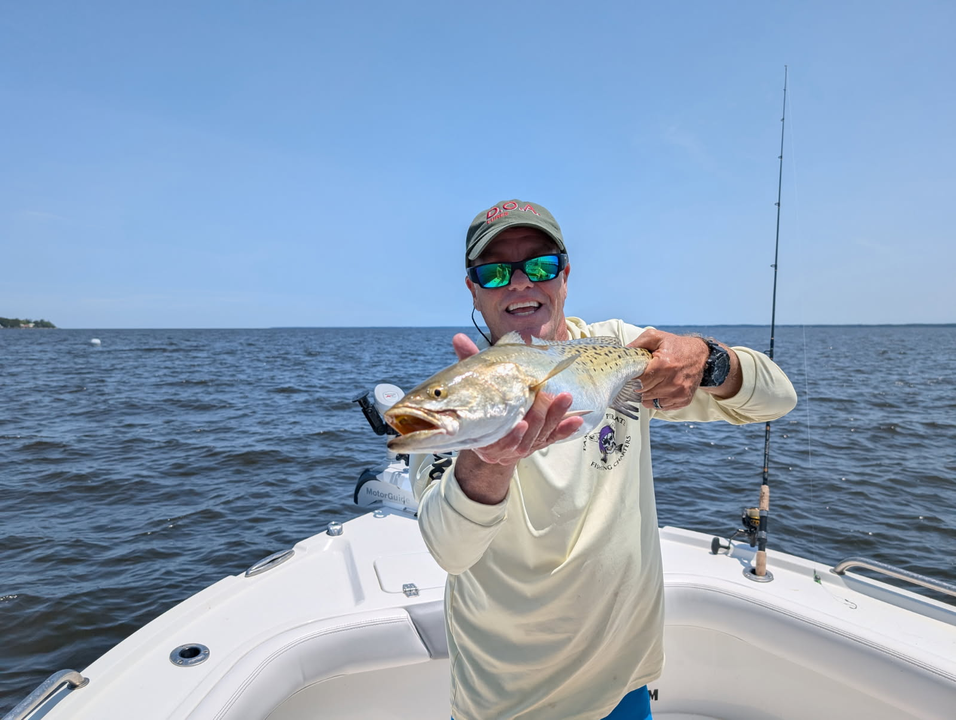 Hooked this spotted weakfish while light tackle fishing on a partly cloudy day.