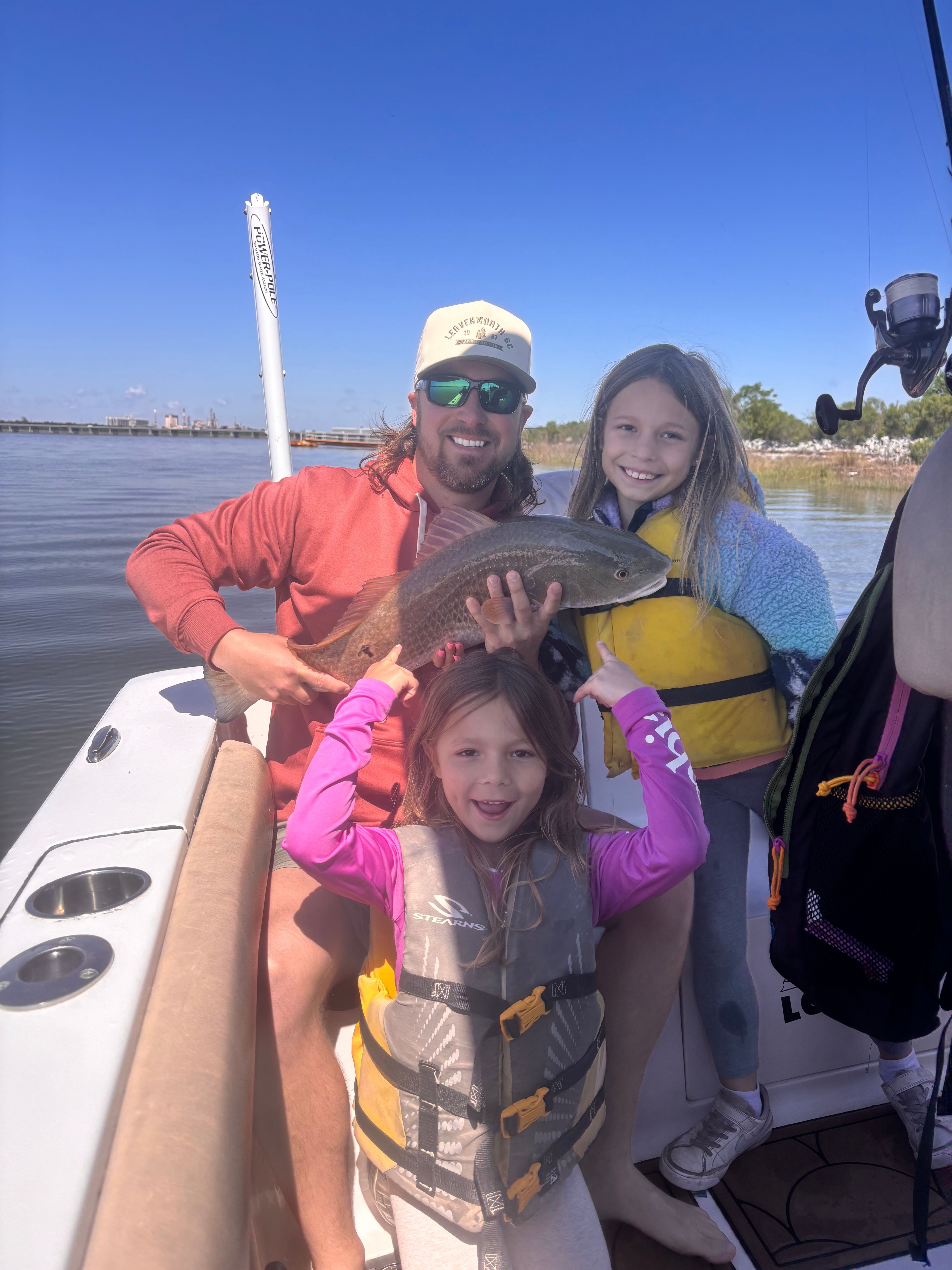 Successful redfish catch displayed on fishing boat deck