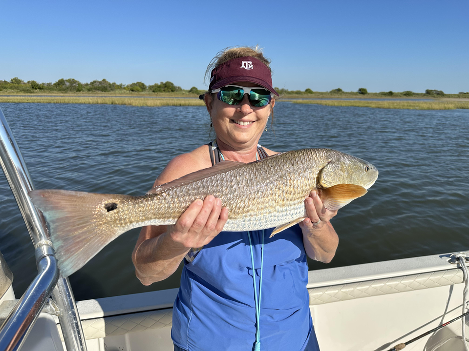 Nice redfish using light tackle and bait casting in Port O'Connor! Perfect clear conditions made for an exciting adventure.