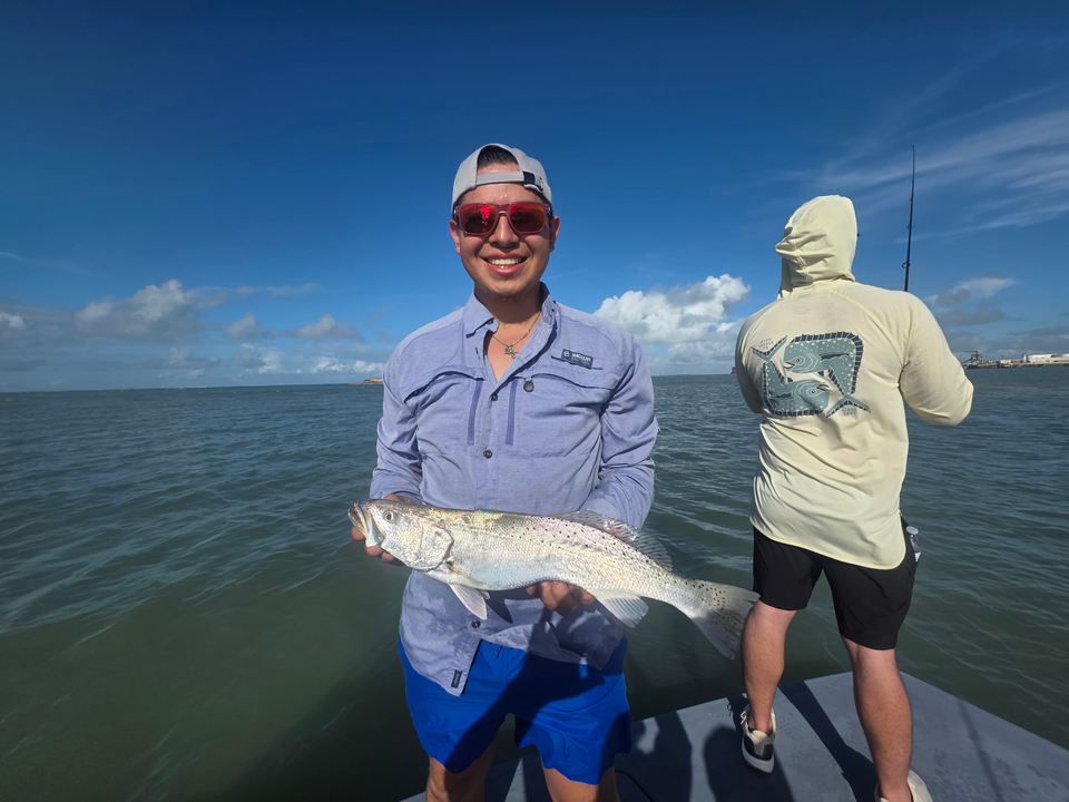 Reeling in the best with a Spotted Weakfish in stormy Port Aransas!