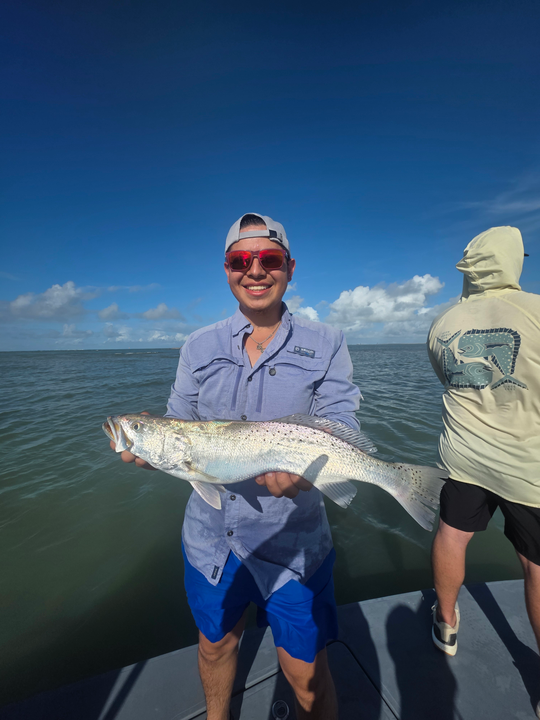 Big Spotted Weakfish reeled in during a stormy day!