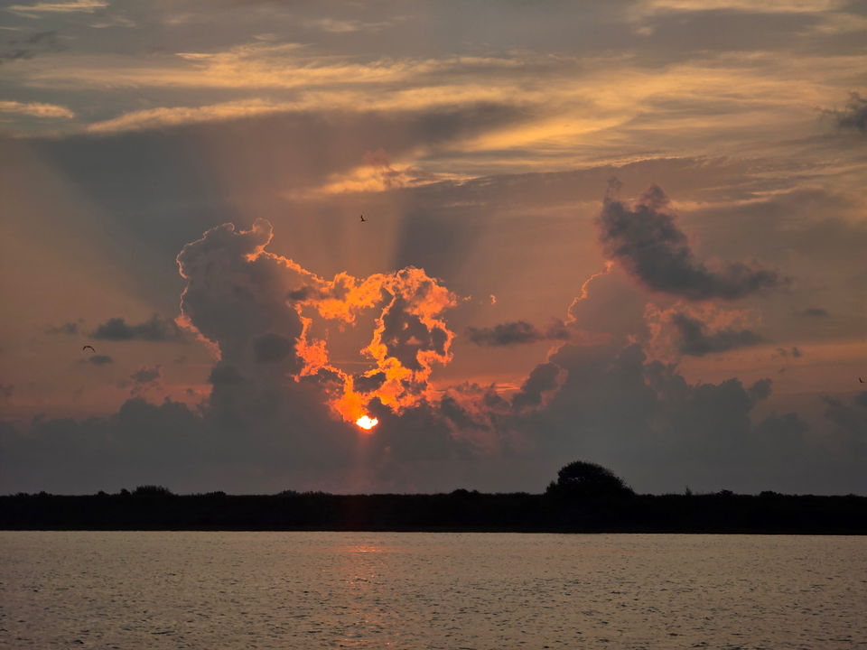 Perfect evening for light tackle drift fishing with clearing skies ahead.