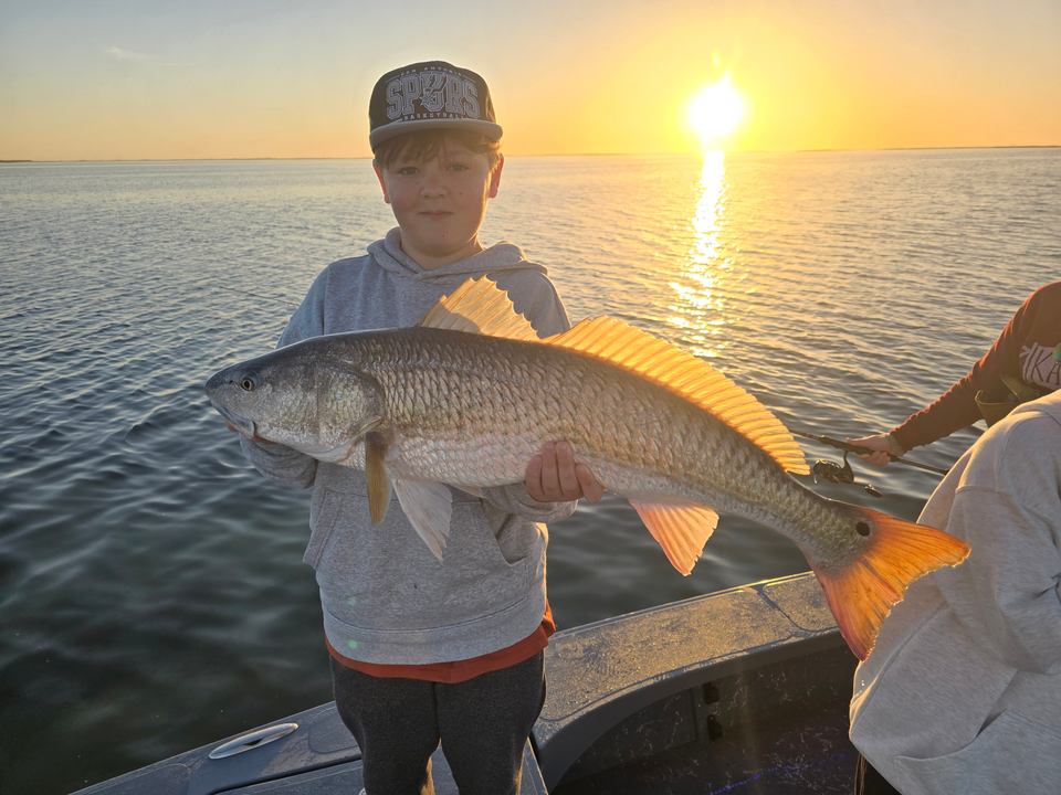 Sunset on the water with a nice catch.