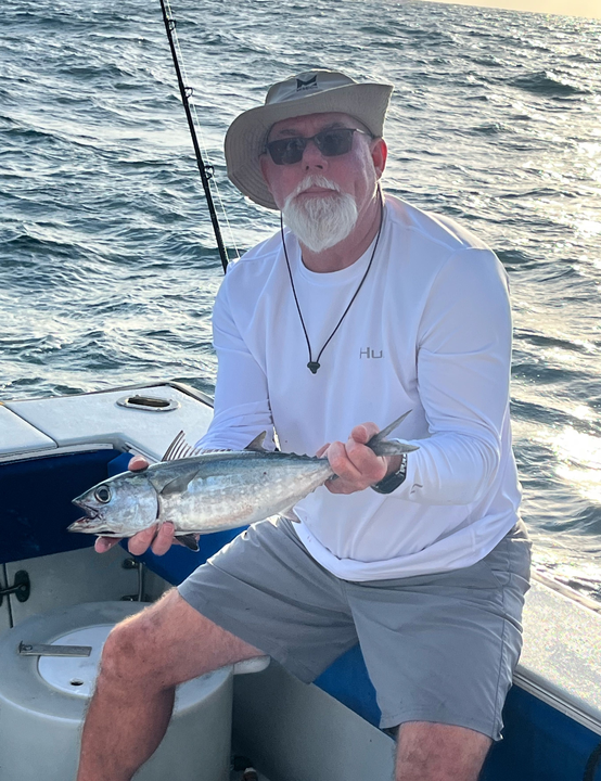 Reeling in the best Blackfin Tuna under stormy West Palm skies!