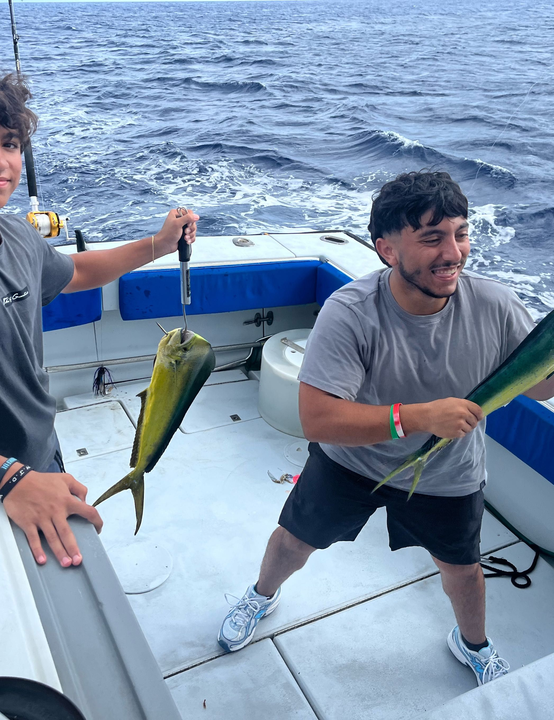 Lucky catch: A 13-inch Mahi Mahi reeled in under partly cloudy skies!