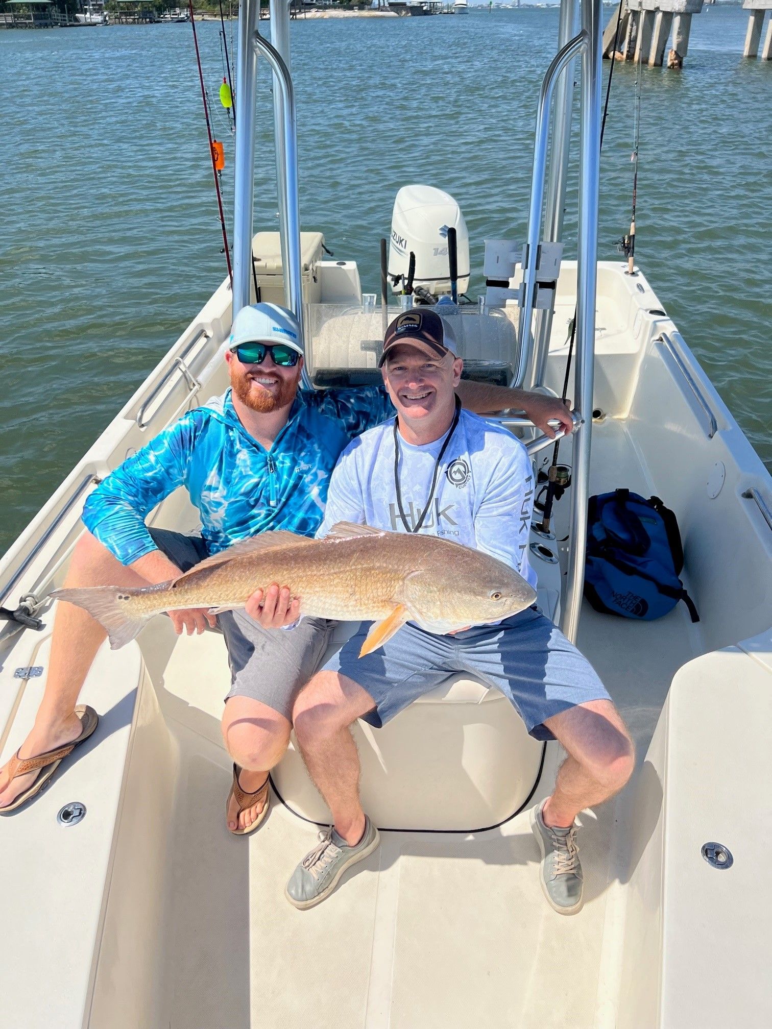 A fisherman holding a 31-inch fish