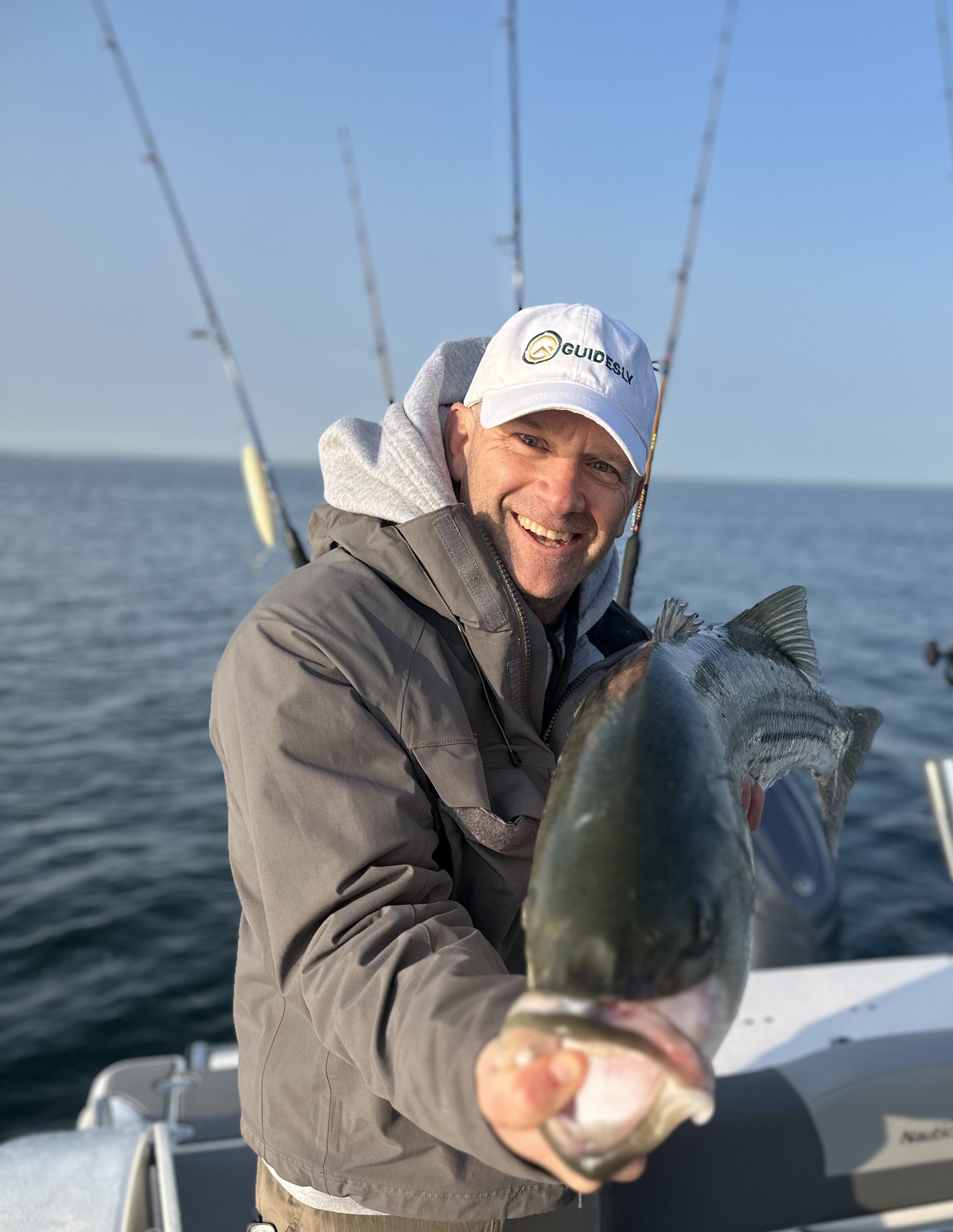 Angler with fishing rod at unknown location