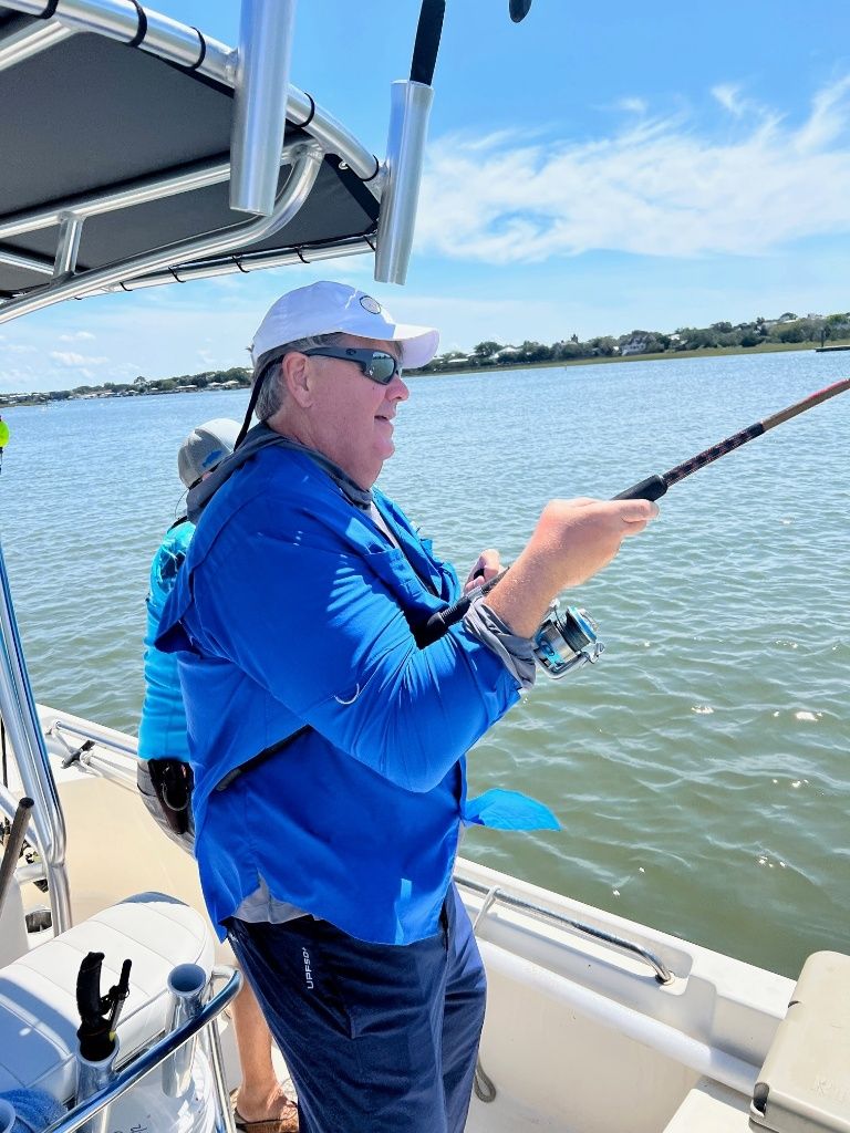 Angler fishing in a scenic outdoor location