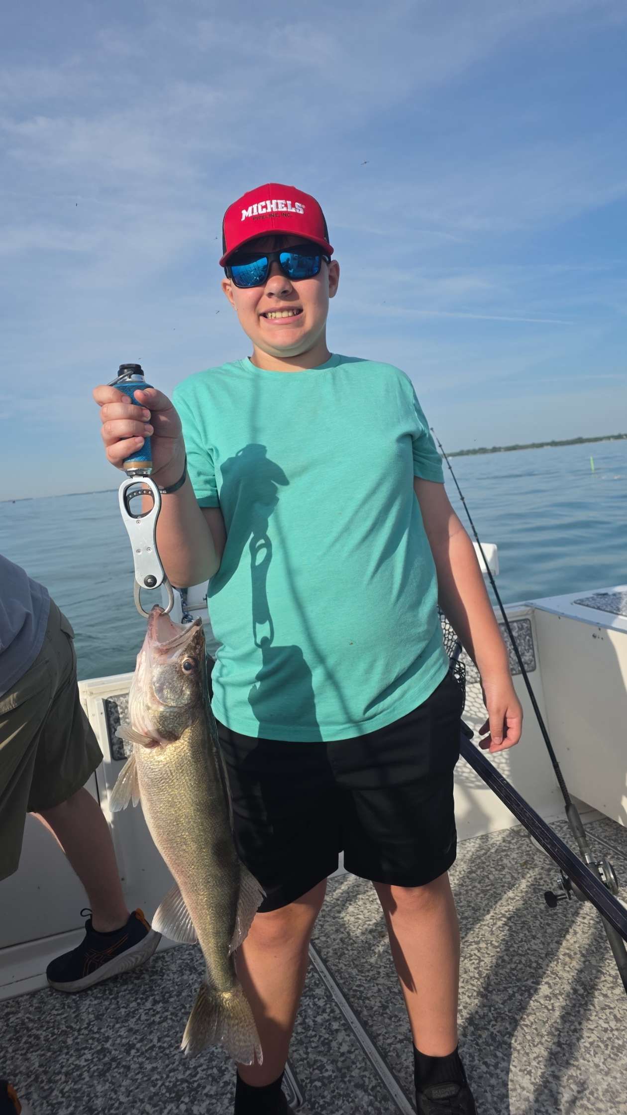 Freshly caught walleye being held on fishing boat