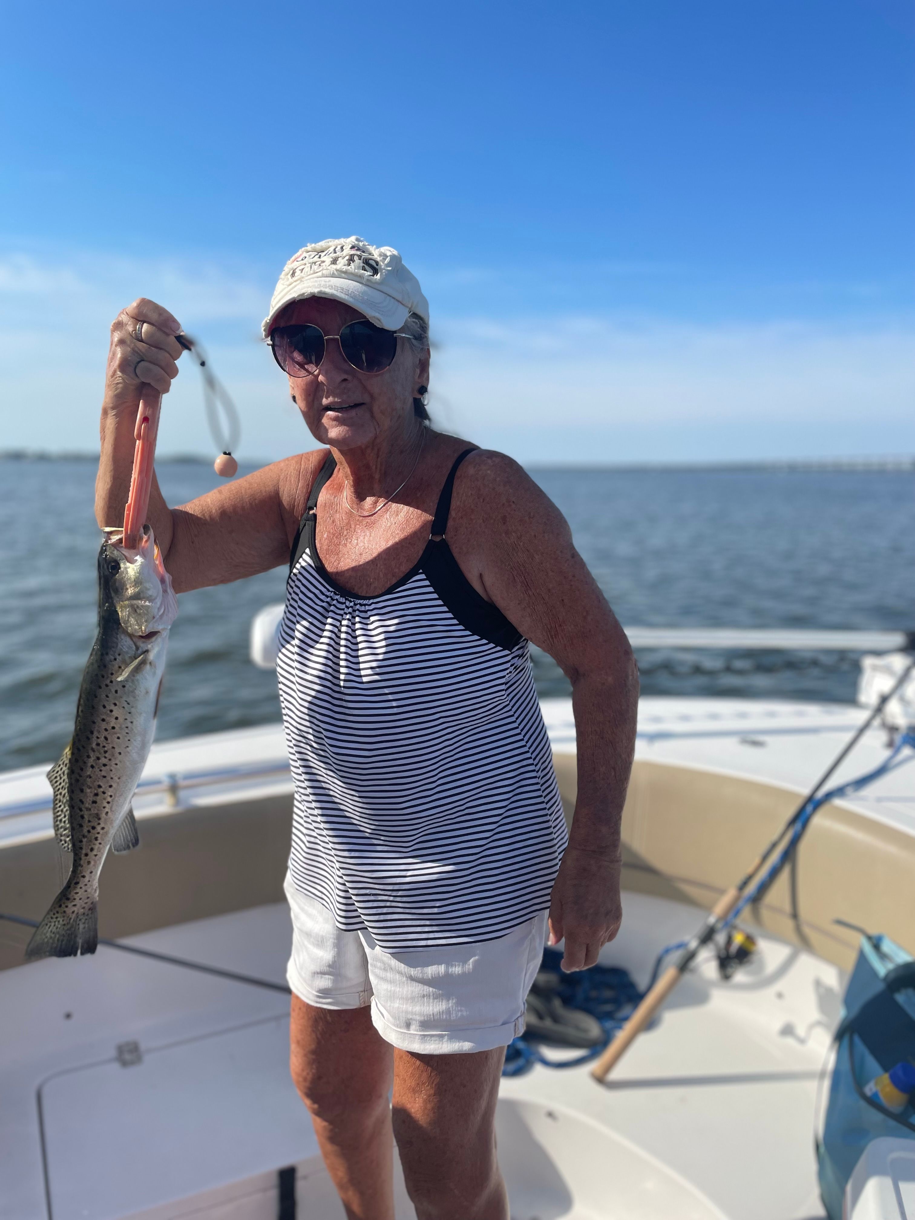 Photograph of a spotted weakfish measuring 18 inches, caught while fishing