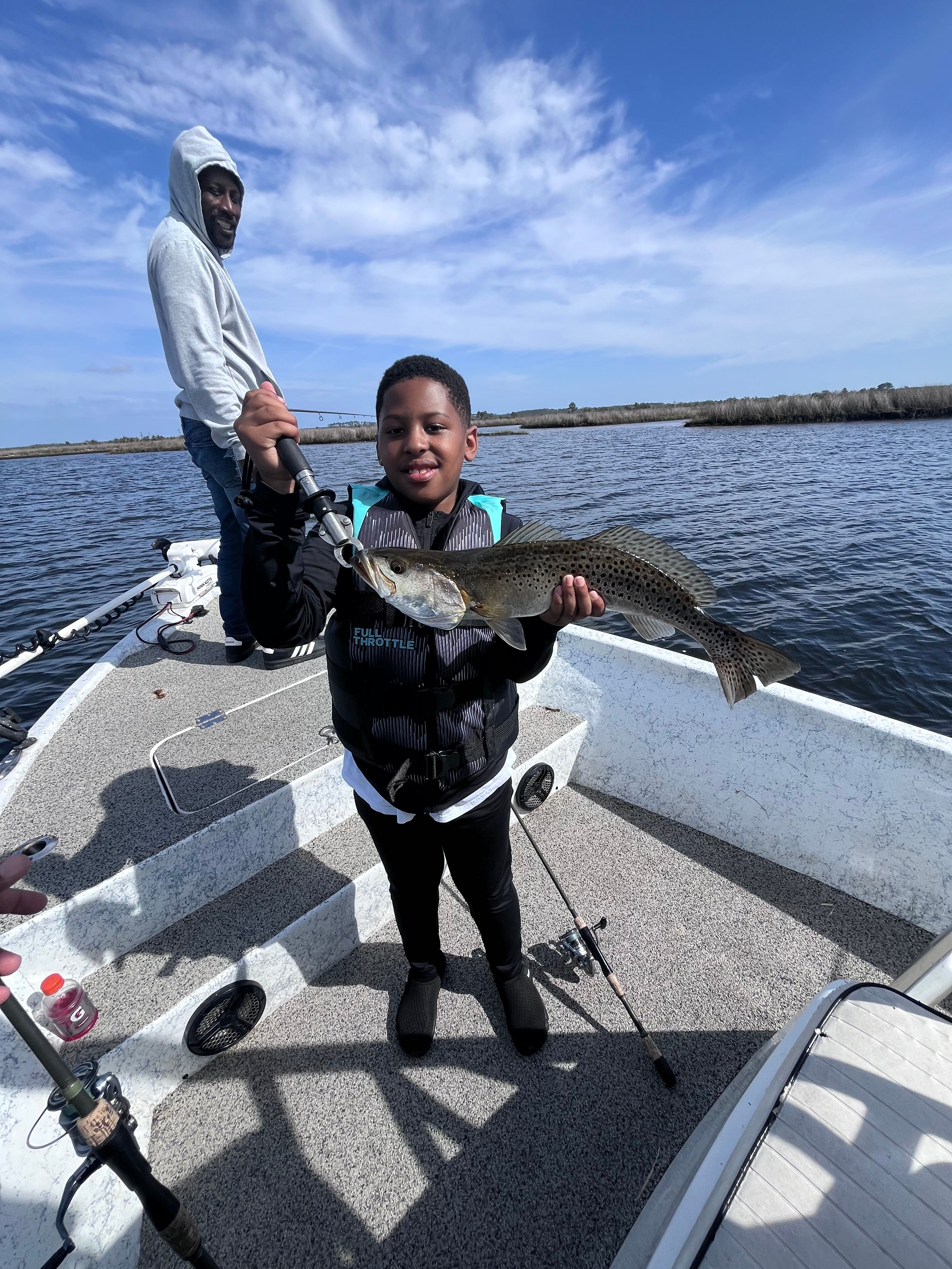 Successful speckled trout fishing catch displayed on boat deck