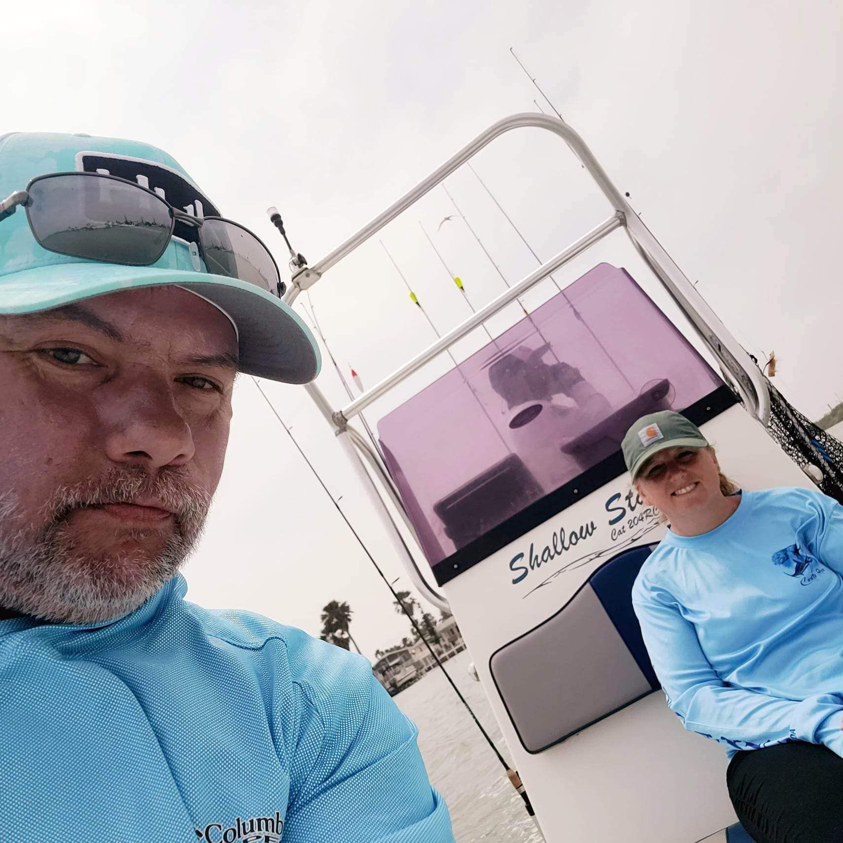 Two people fishing in an unknown location