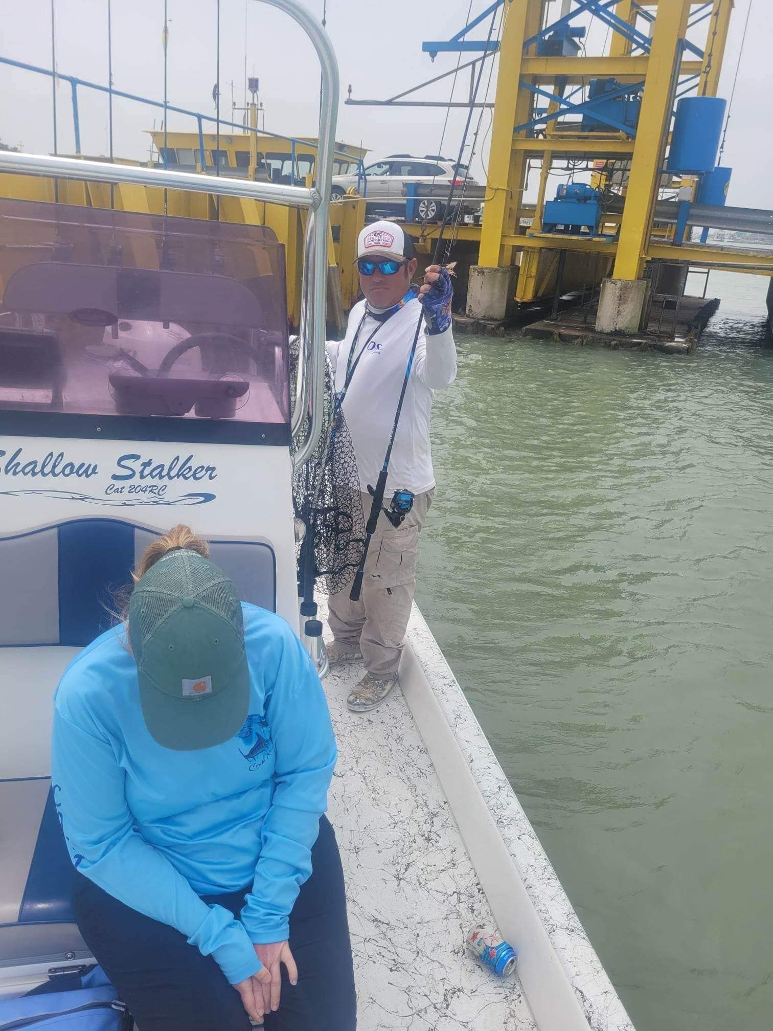 A person fishing in an unknown location