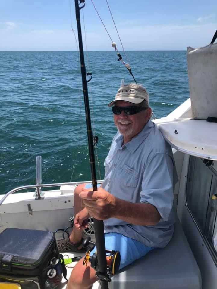 Person fishing at an unknown location