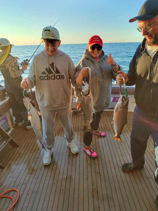 Great day on the water with three fish caught using deep sea trolling and heavy tackle under clear skies!