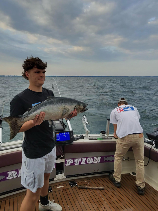 Reeling in a huge catch with deep sea trolling in Olcott!