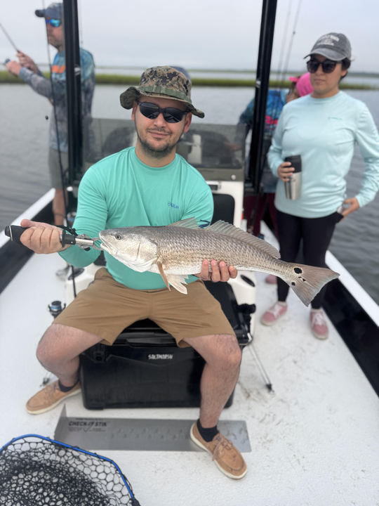 Huge redfish caught with light tackle as skies clear!