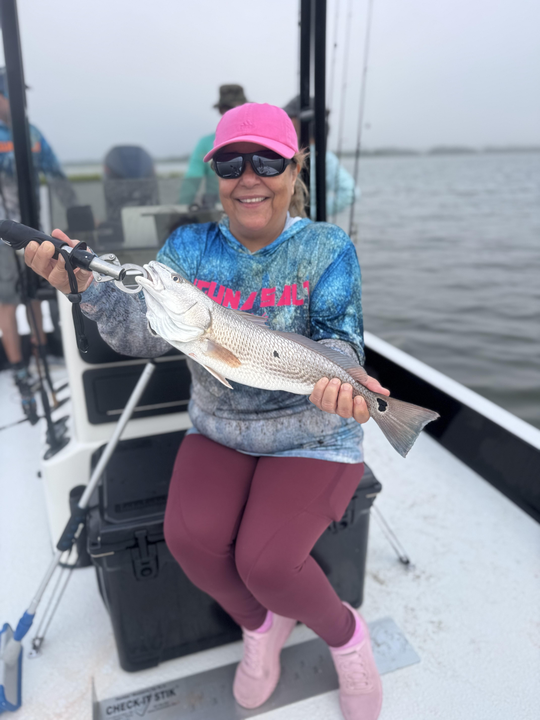 Light tackle magic lands a redfish as skies clear in Hubert!