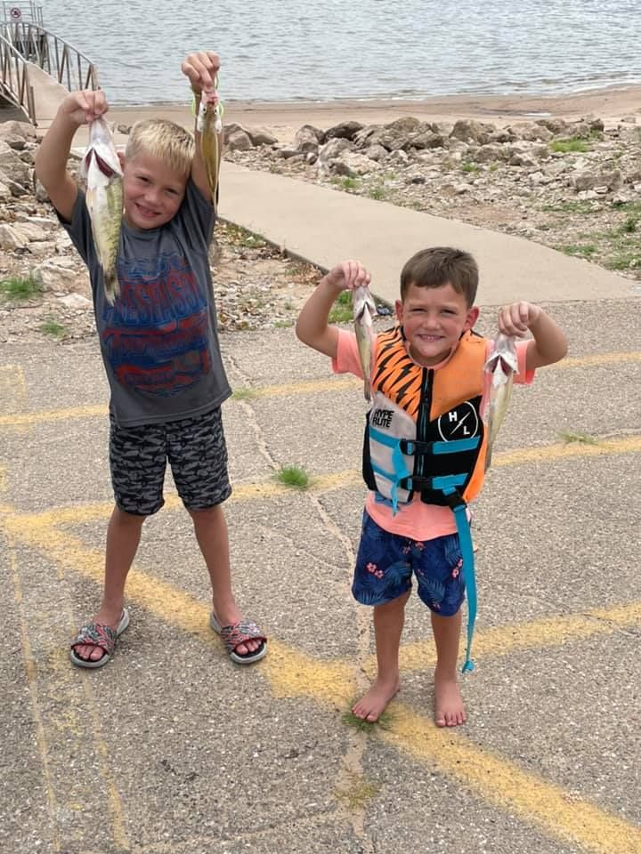 Two people fishing in an unknown location