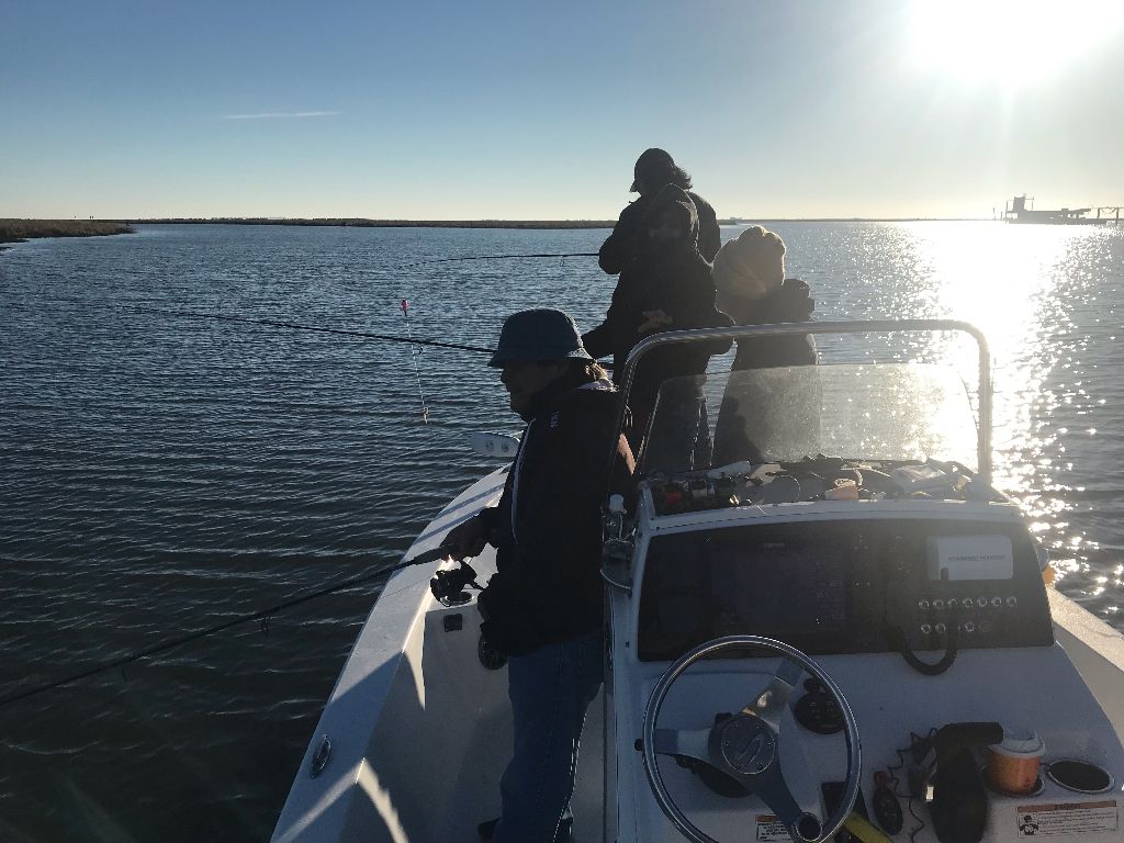 A person fishing in an unknown location