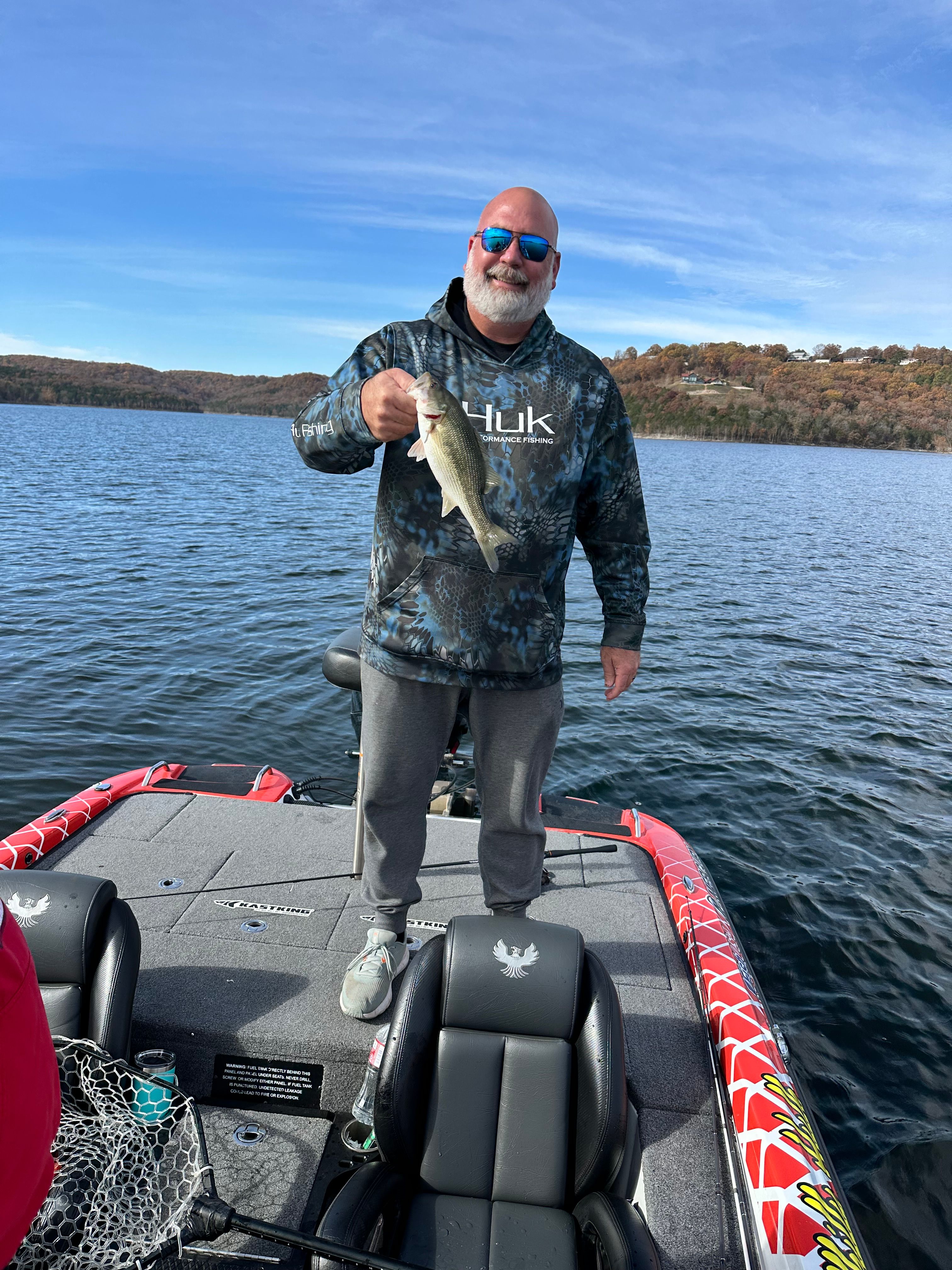 A person fishing at an unknown location