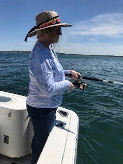 Person fishing in an unknown location