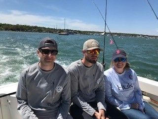 Trio of anglers fishing at a scenic location