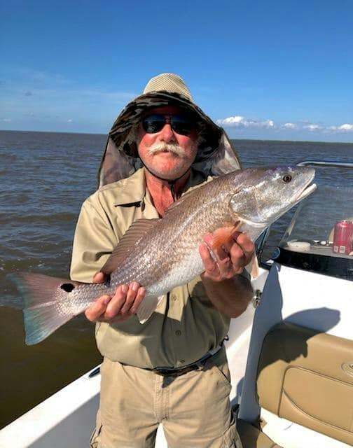 A fisherman enjoying a day of fishing