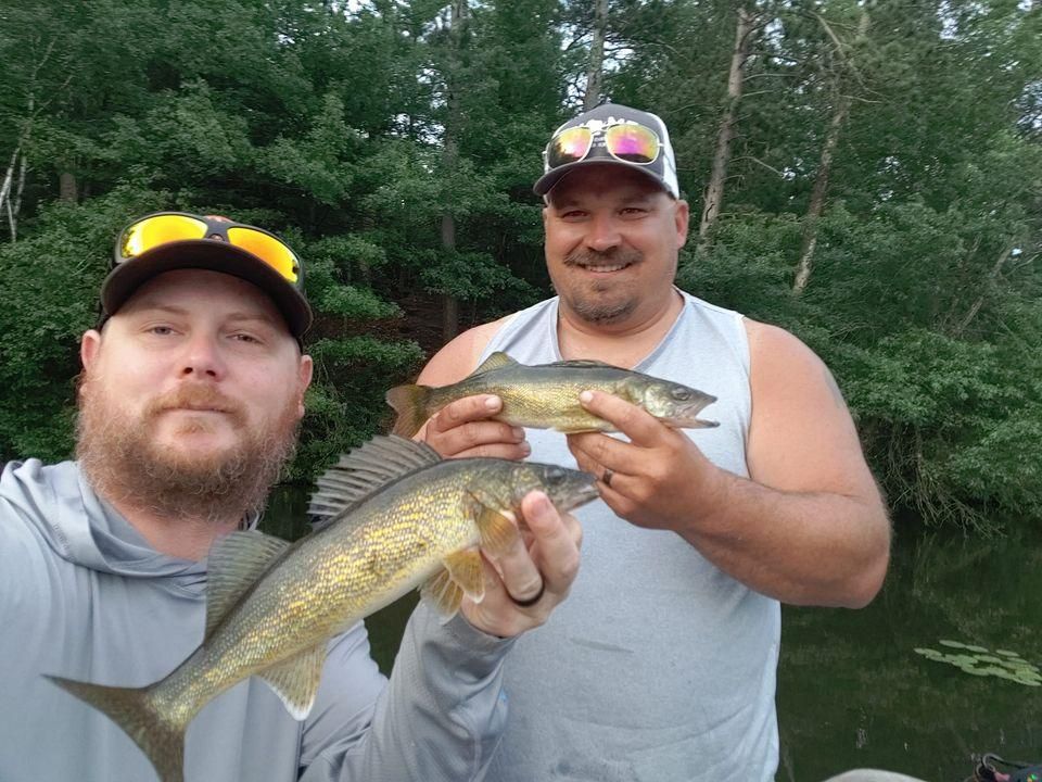Two sauger fish, fishing in unknown location
