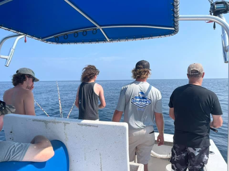 A person fishing in an unknown location