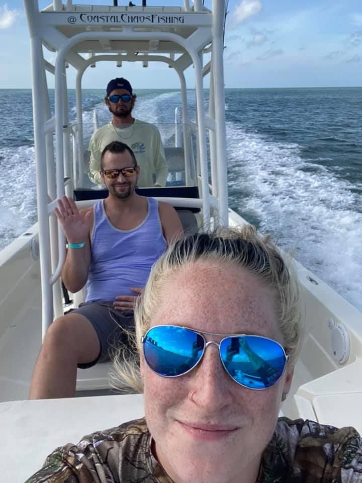 3 people fishing in unknown location